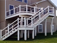 <b>Trex Composite deck & porch with white vinyl railing & black ballusters, facia board and wrapped beams & posts</b>